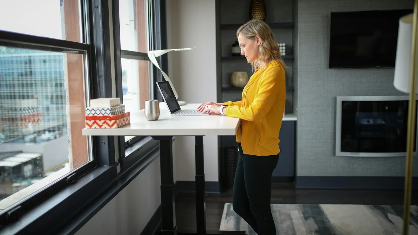 Home office standing desk setup where an under desk treadmill for home office use would sit